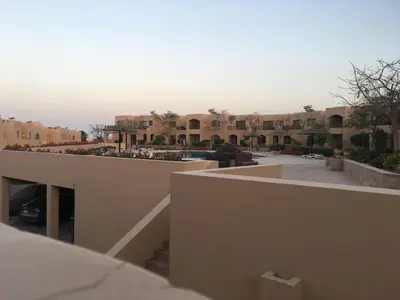 a view of a building with a parking lot at Pool View one bedroom at Hurghada - B101 in Hurghada