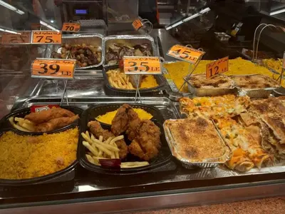 a buffet line with different types of food on display at apartman Eva in Hurghada