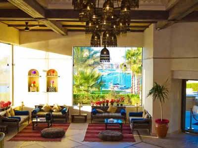 a lobby of a resort with couches and a pool at Marina Lodge at Port Ghalib in Port Ghalib