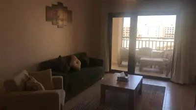 a living room with a couch and a coffee table at Hurghada Furnished Appratment - Al Dau Hights Al Mamsha in Hurghada