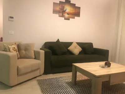 a living room with a couch and a coffee table at Hurghada Furnished Appratment - Al Dau Hights Al Mamsha in Hurghada