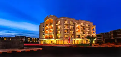 a tall building with an orange light on it at JAZ Neo Ivory in Hurghada