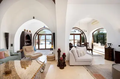 a living room with white walls and arched ceilings at VESTA - El Gouna Residence in Hurghada