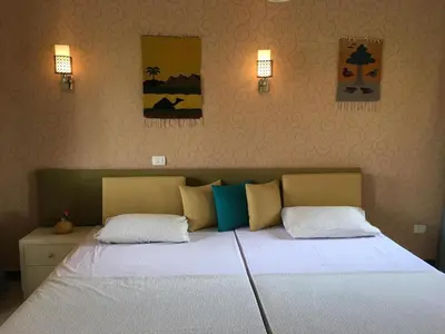 a bedroom with a large bed with two pillows at Apartment in Stella di Mare Hurghada in Hurghada