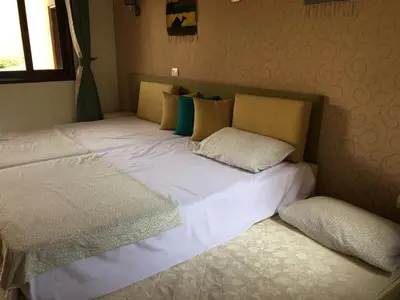 a bed with two pillows on it in a bedroom at Apartment in Stella di Mare Hurghada in Hurghada