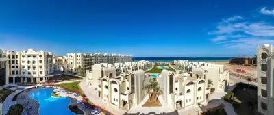 an aerial view of a resort with buildings and the ocean at Gravity Hotel & Aqua Park Sahl Hasheesh Families and Couples Only in Hurghada