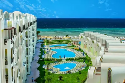 a view of the beach from the balcony of a building at Gravity Hotel & Aqua Park Sahl Hasheesh Families and Couples Only in Hurghada