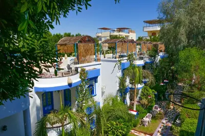 a view of a town with blue and white buildings at El Gezira Garden Hotel Luxor in Luxor