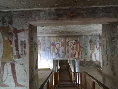 a hallway in an ancient building with paintings on the walls at Apartment in Luxor city center-Nil in Luxor