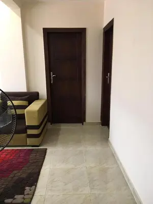 a living room with a door and a couch at Apartment in Luxor city center-Nil in Luxor