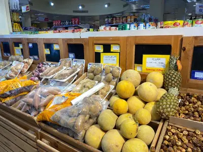 a display of fruits and vegetables in a grocery store at Zebra House Hurghada center in Hurghada