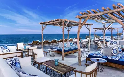 a restaurant with a view of the ocean at JAZ Elite Maraya in Coraya Bay