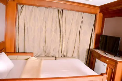 a small bedroom with a bed and a window at Nile Cruise Luxor Aswan 3,4 and 7 nights in Aswan