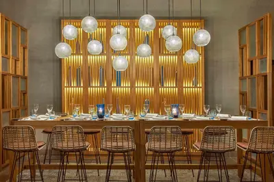 a long table with chairs and glasses on it at Steigenberger Resort Alaya Marsa Alam - Red Sea - Adults Friendly 16 Years Plus in Coraya Bay