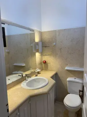 a bathroom with a sink and a toilet at El gouna South Marina Townhouse Apartment 3 bedrooms in Hurghada