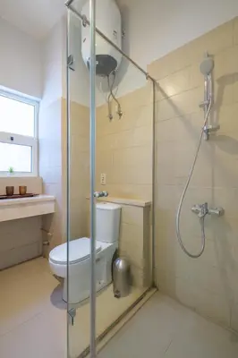 a bathroom with a toilet and a shower at Luxury 3 Bedroom Apt. in El Gouna with amazing view in Hurghada