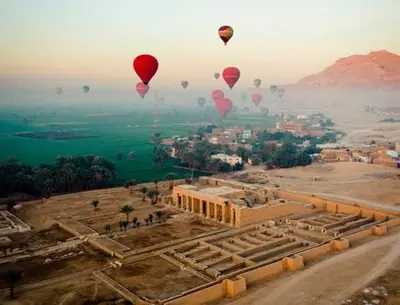 a group of hot air balloons flying over a city at Villa Bahri Luxor Apartment in Luxor