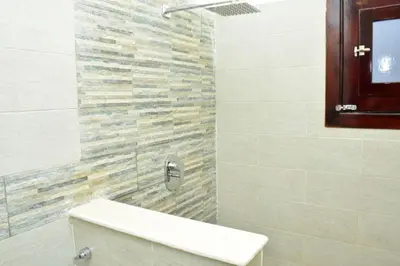a bathroom with a sink and a stone wall at The View El Quseir in Quseir