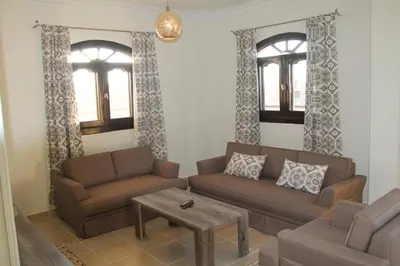a living room with two couches and a coffee table at The View El Quseir in Quseir