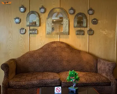 a living room with a couch and some mirrors at GTS Nile Cruise Luxor Aswan every monday from Luxor friday from Aswan in Luxor
