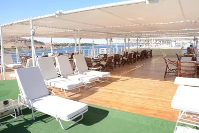 a deck of a cruise ship with white chairs and tables at GTS Nile Cruise Luxor Aswan every monday from Luxor friday from Aswan in Luxor