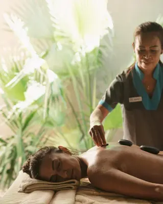 a woman getting a massage from a therapist at Casa Cook El Gouna - Adults Only in Hurghada