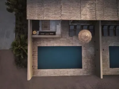 a flat screen tv attached to a brick wall at Casa Cook El Gouna - Adults Only in Hurghada