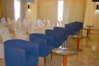 a row of chairs and tables in a room at Royal Lagoons Resort & Aqua Park Families and Couples Only in Hurghada
