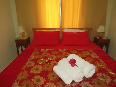 a bed with towels and pillows on it at Apartment Dolce Vita near the sea RedSeaLine in Hurghada