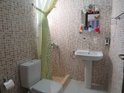 a bathroom with a toilet and a sink at Apartment Dolce Vita near the sea RedSeaLine in Hurghada