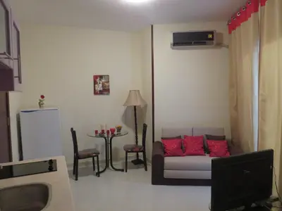 a living room with a couch and a table at Apartment Dolce Vita near the sea RedSeaLine in Hurghada