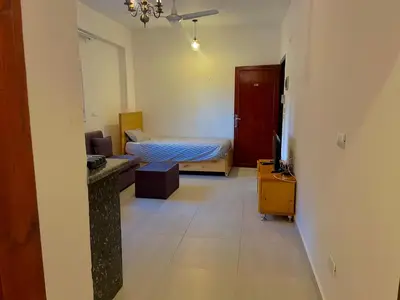a small room with a bed and a bathroom at Nile Panorama Hotel & Restaurant in Luxor