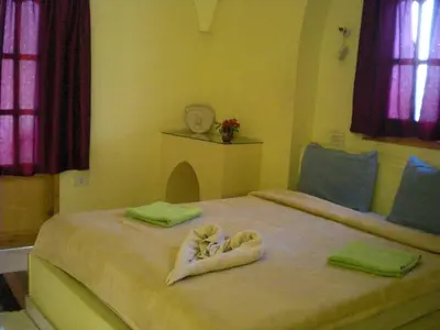 a bedroom with two towels on a bed at El Fayrouz Hotel in Luxor