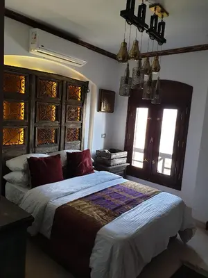 a bedroom with a large bed in a room at Dar Om Ali ElGouna Sabina y160 2 14 in El Gouna