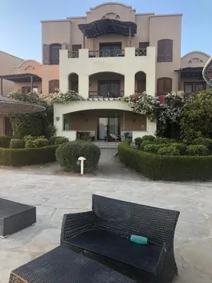a large building with a bench in front of it at Dar Om Ali ElGouna Sabina y160 2 14 in El Gouna