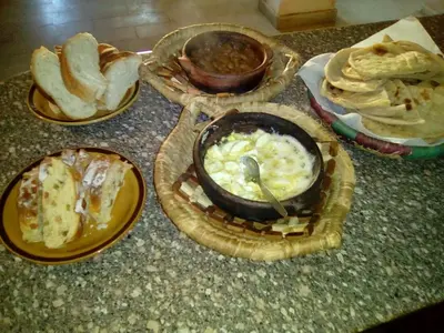 a group of plates of food on a counter at Pharaohs Hotel in Luxor