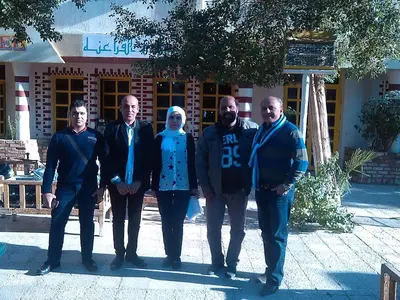 a group of people standing in front of a building at Pharaohs Hotel in Luxor