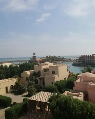 a view of a group of buildings and a body of water at El Gouna abu tig marina Studio p economy stay in Hurghada