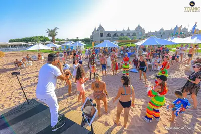 a group of people dancing on a beach at Titanic Royal-Families and Couples only in Hurghada