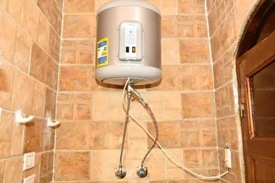 a soap dispenser on the wall of a bathroom at Om-Abdallah in Aswan