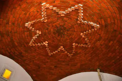 a large straw hat with a flower on it at Om-Abdallah in Aswan