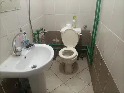 a bathroom with a white toilet and a sink at Hana hostel not for Egyptian in Hurghada