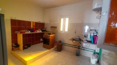 a small kitchen with a sink and a stove at Hana hostel not for Egyptian in Hurghada