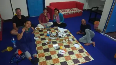 a group of people sitting around a table at Hana hostel not for Egyptian in Hurghada