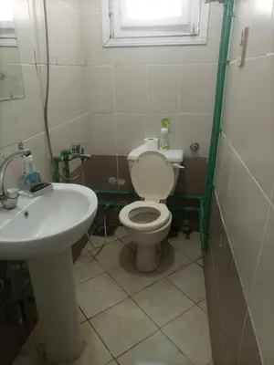 a bathroom with a toilet and a sink at Hana hostel not for Egyptian in Hurghada