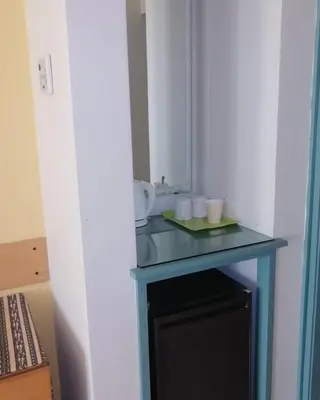 a blue table with a sink in a room at EL Gouna Abu tig Studio- Economy stay in Hurghada