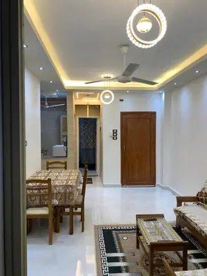 a dining room with a table and chairs and a ceiling at Roma Apartment ( Center Of Hurghada, Sheraton Road ) in Hurghada