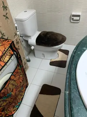 a bathroom with a toilet and a sink at Roma Apartment ( Center Of Hurghada, Sheraton Road ) in Hurghada