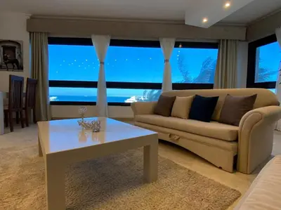 a living room with a couch and a table at Alia Beach Residence in Hurghada