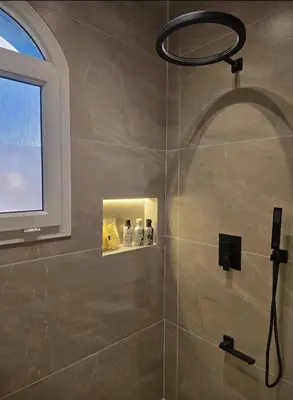 a shower with a shower head in a bathroom at Luxury Royal Blue Family Villa 8pers private pool in Hurghada